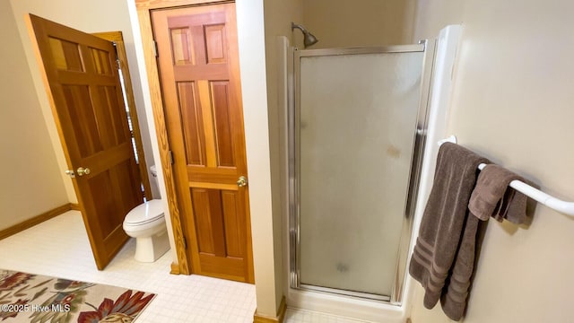 bathroom featuring toilet and walk in shower