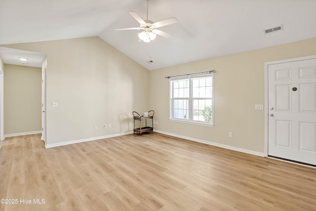 interior space with visible vents, baseboards, light wood-style floors, lofted ceiling, and ceiling fan