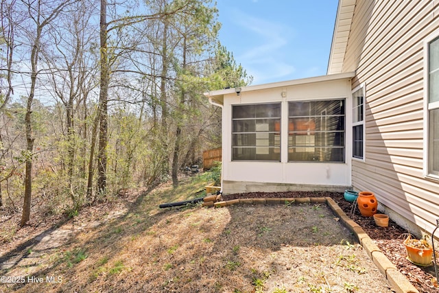 view of yard with a sunroom