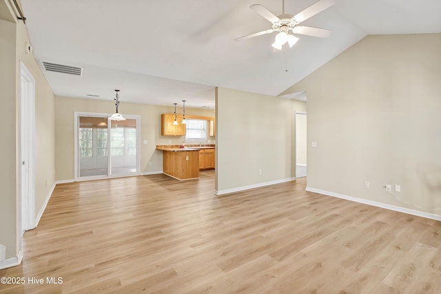 unfurnished living room featuring baseboards, visible vents, light wood finished floors, and ceiling fan