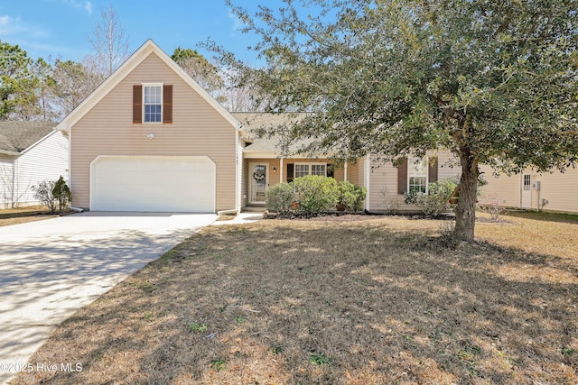 view of front of property with driveway, a front yard, and a garage