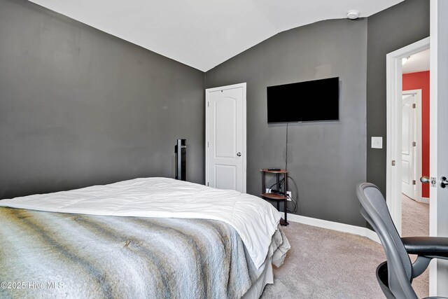 2306 Cottagefield Ln, Leland, NC 28451 - bedroom with vaulted ceiling and carpet floors