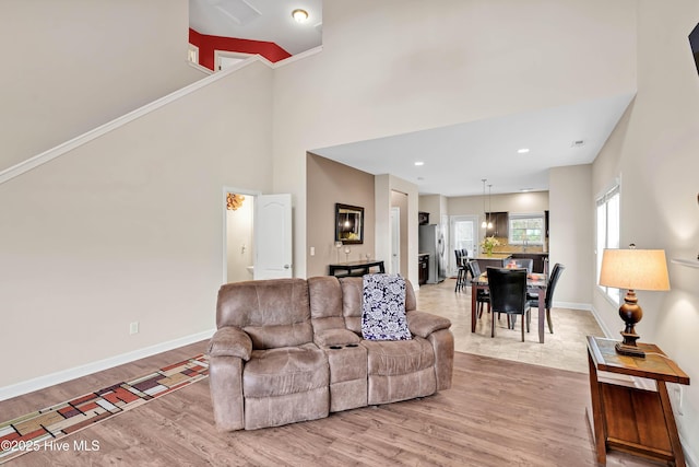 2306 Cottagefield Ln, Leland, NC 28451 - living room featuring a high ceiling and light hardwood / wood-style flooring