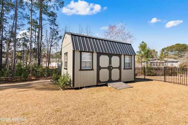 view of shed with fence