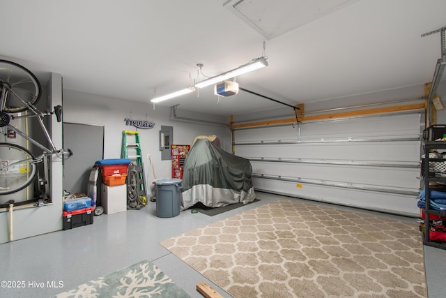 garage featuring electric panel and a garage door opener