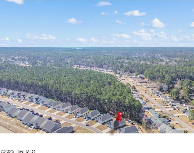 aerial view featuring a residential view and a view of trees