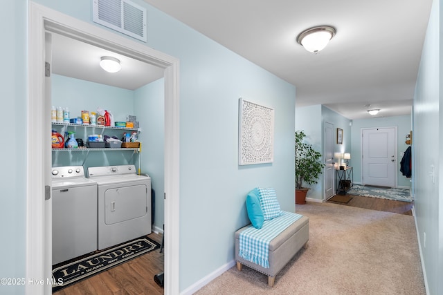 washroom with carpet, visible vents, separate washer and dryer, laundry area, and baseboards