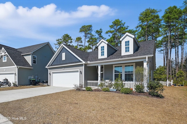 view of front of house featuring a garage, driveway, a porch, and a shingled roof