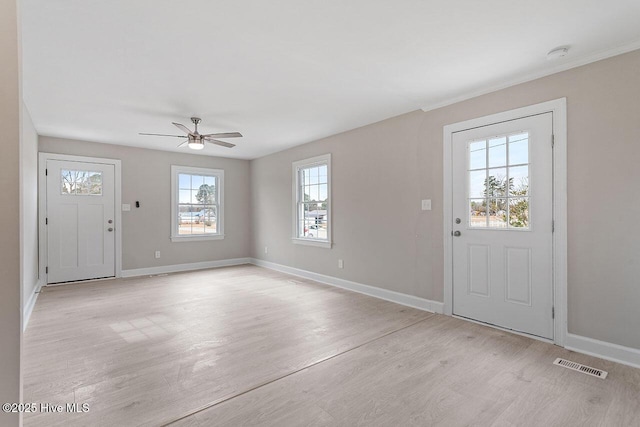 entrance foyer with ceiling fan and light hardwood / wood-style floors