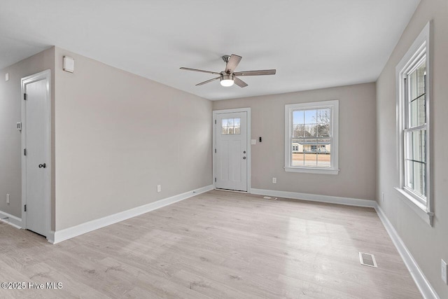 foyer featuring ceiling fan and light wood-type flooring