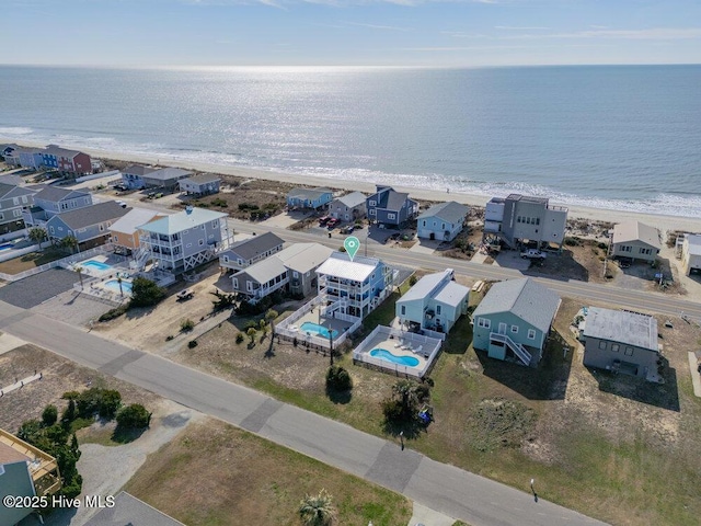 aerial view with a view of the beach and a water view