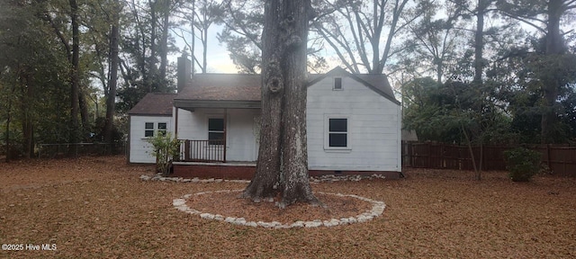 exterior space featuring crawl space, fence, and a porch