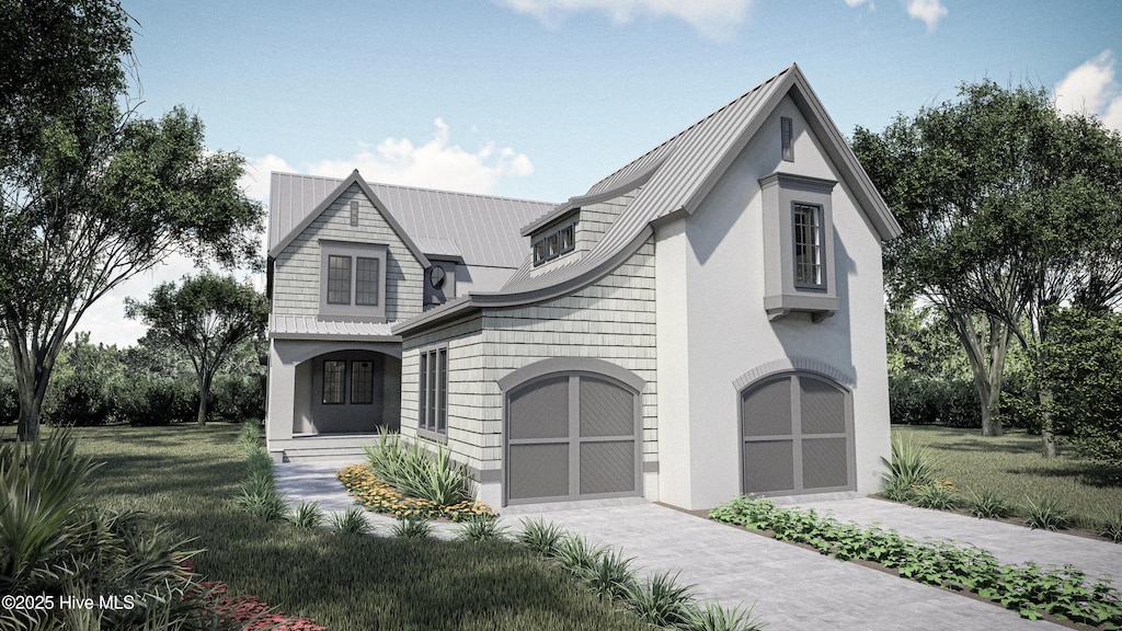 view of front facade featuring driveway, a garage, metal roof, and a front yard