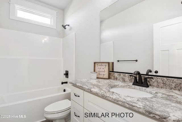 full bathroom with vanity, shower / bathtub combination, and toilet