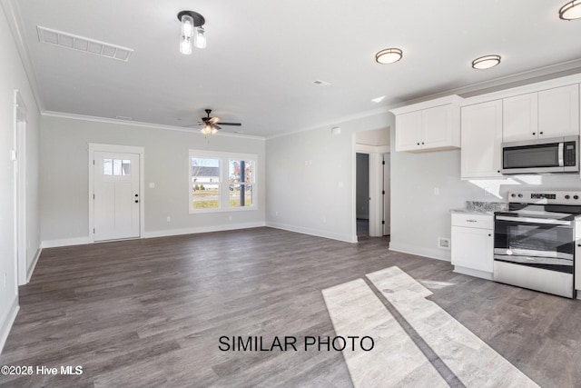 kitchen with appliances with stainless steel finishes, dark hardwood / wood-style floors, white cabinets, ceiling fan, and crown molding