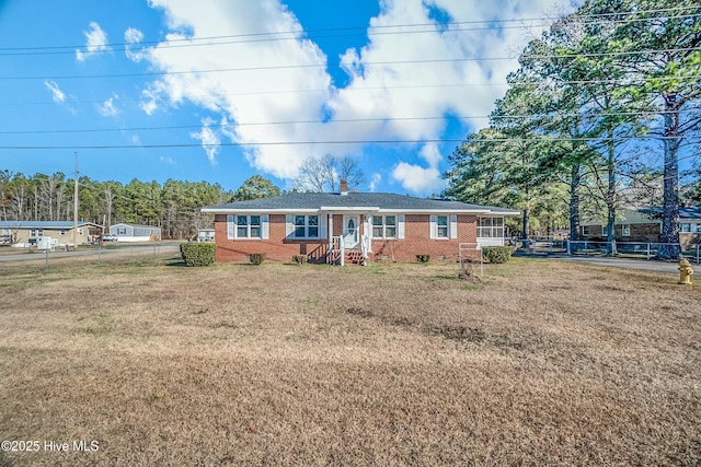 ranch-style house with a front yard