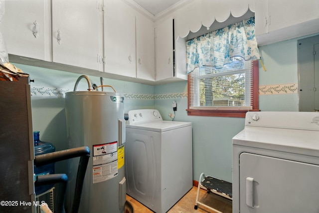 washroom with crown molding, cabinets, washer and clothes dryer, and water heater