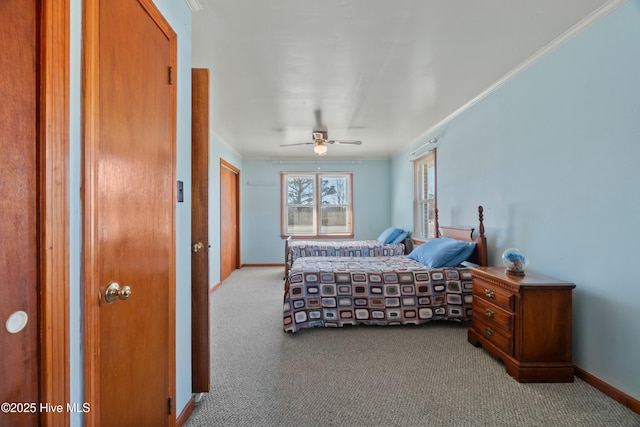 bedroom with crown molding, light colored carpet, and ceiling fan