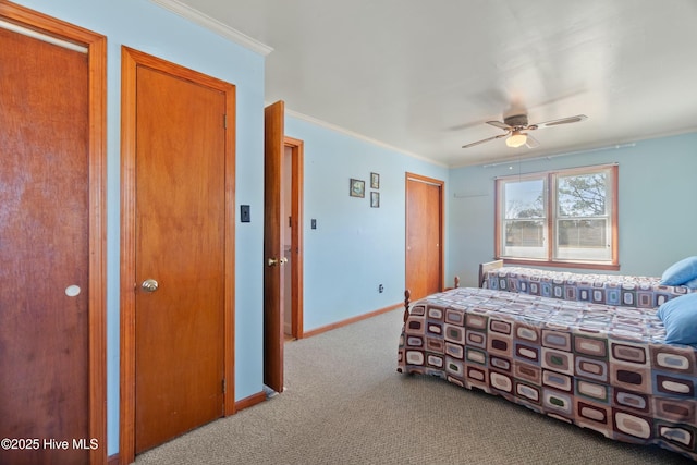 bedroom with multiple closets, crown molding, light carpet, and ceiling fan