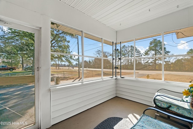 unfurnished sunroom featuring a healthy amount of sunlight