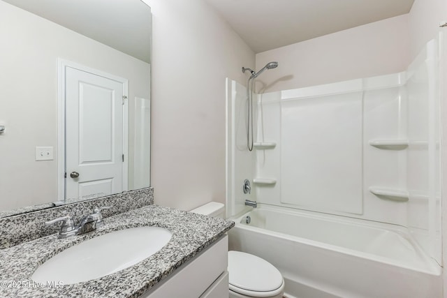 full bathroom featuring vanity, bathtub / shower combination, and toilet