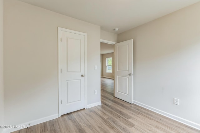 unfurnished bedroom with light hardwood / wood-style flooring