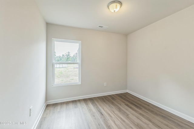 spare room with light wood-type flooring