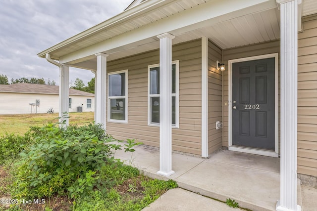 view of exterior entry featuring a porch