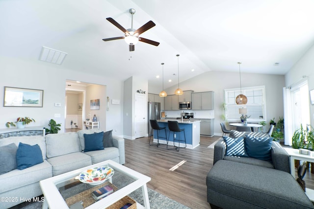 living room featuring lofted ceiling, sink, dark hardwood / wood-style floors, and ceiling fan