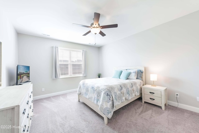 bedroom featuring light colored carpet and ceiling fan