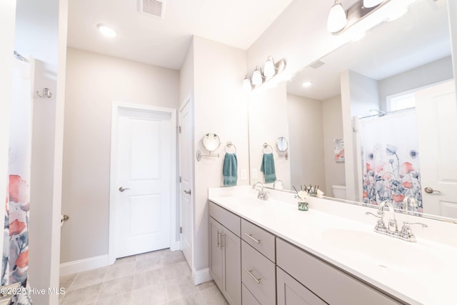 bathroom featuring a shower with curtain, tile patterned floors, vanity, and toilet