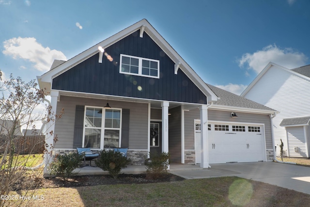 craftsman-style house with a garage and covered porch