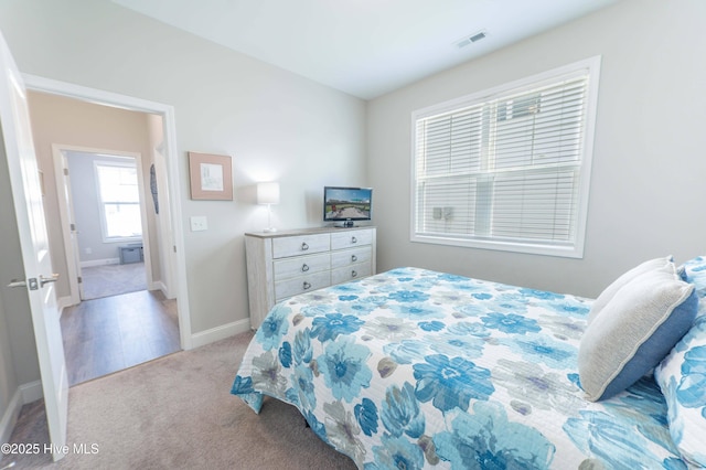 bedroom with light carpet