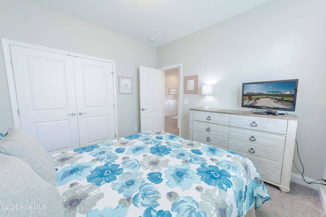 carpeted bedroom with a closet