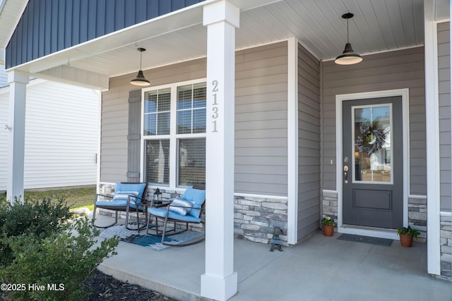 entrance to property featuring a porch