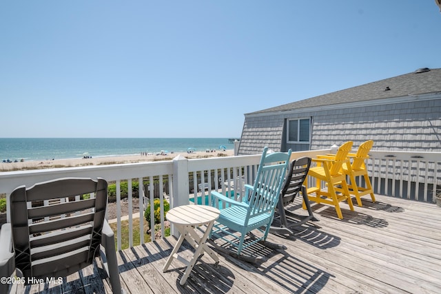wooden deck featuring a water view
