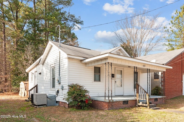 bungalow featuring central AC and a porch