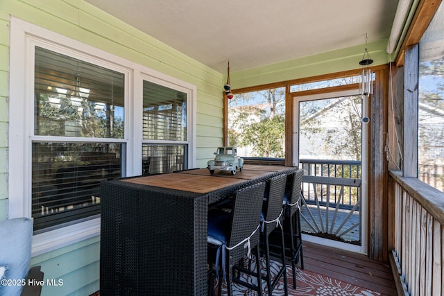 169 NW 7th St, Oak Island, NC 28465 - sunroom / solarium featuring outdoor dining space