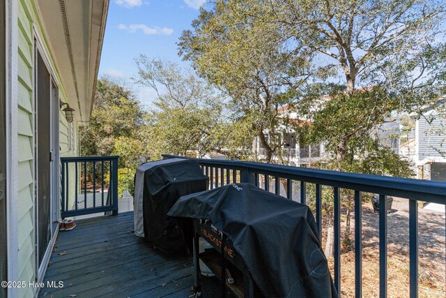 169 NW 7th St, Oak Island, NC 28465 - wooden terrace featuring grilling area