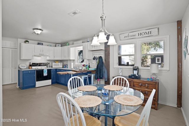 169 NW 7th St, Oak Island, NC 28465 - dining area featuring finished concrete floors and baseboards