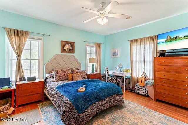 bedroom featuring ceiling fan and wood finished floors