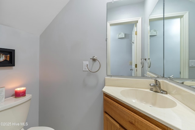 103 Ridge Rd, Hampstead, NC 28443 - half bathroom with toilet, vaulted ceiling, and vanity