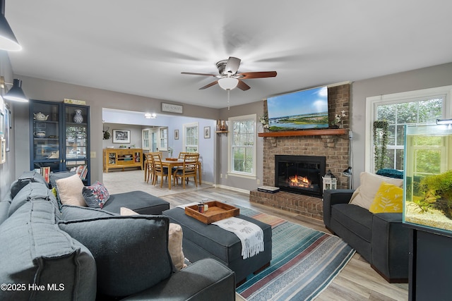 103 Ridge Rd, Hampstead, NC 28443 - living room featuring a ceiling fan, light wood-type flooring, and a brick fireplace
