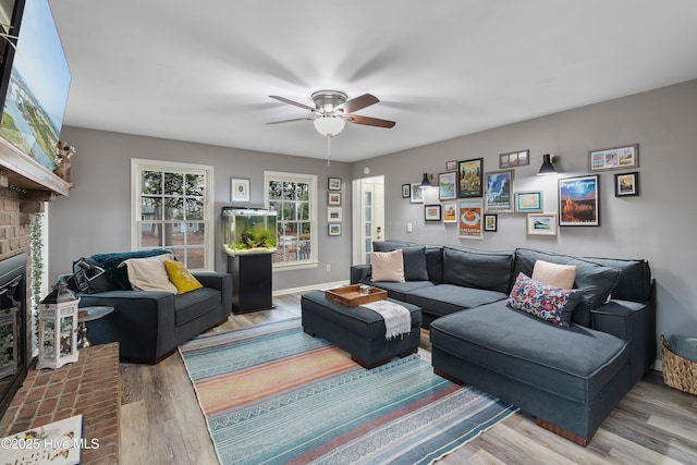 103 Ridge Rd, Hampstead, NC 28443 - living room with wood finished floors, a fireplace, a ceiling fan, and baseboards