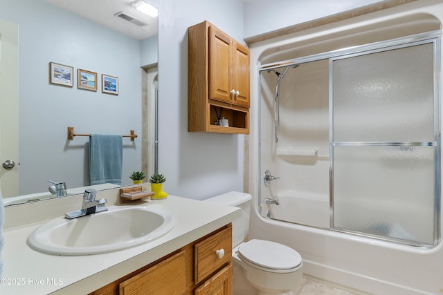 103 Ridge Rd, Hampstead, NC 28443 - bathroom featuring toilet, vanity, and bath / shower combo with glass door