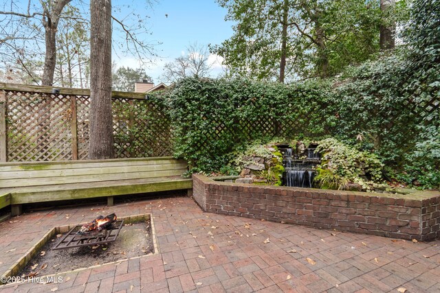 103 Ridge Rd, Hampstead, NC 28443 - view of patio featuring a fire pit