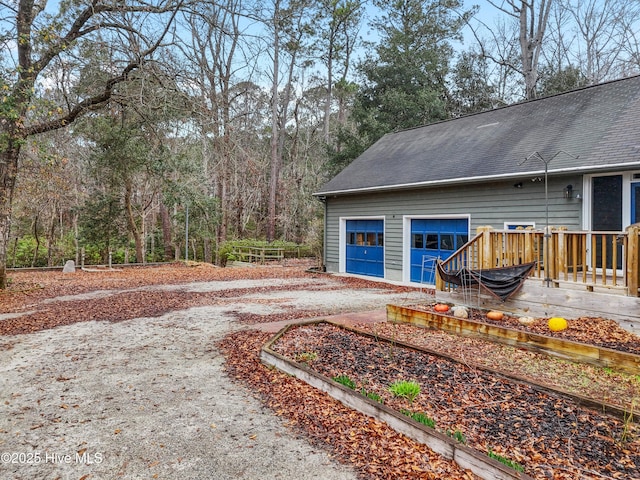 103 Ridge Rd, Hampstead, NC 28443 - view of yard featuring driveway, a wooden deck, and a garage