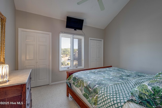 bedroom with baseboards, a ceiling fan, light colored carpet, and vaulted ceiling