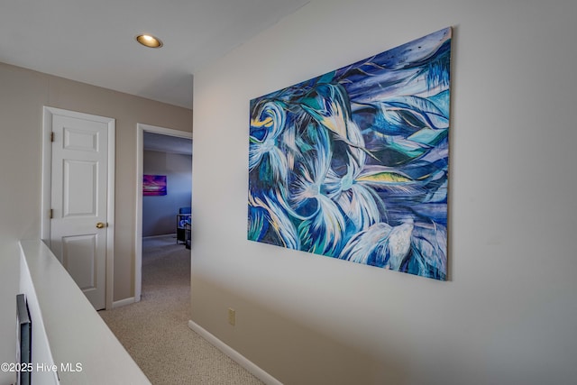 hall featuring recessed lighting, baseboards, and carpet