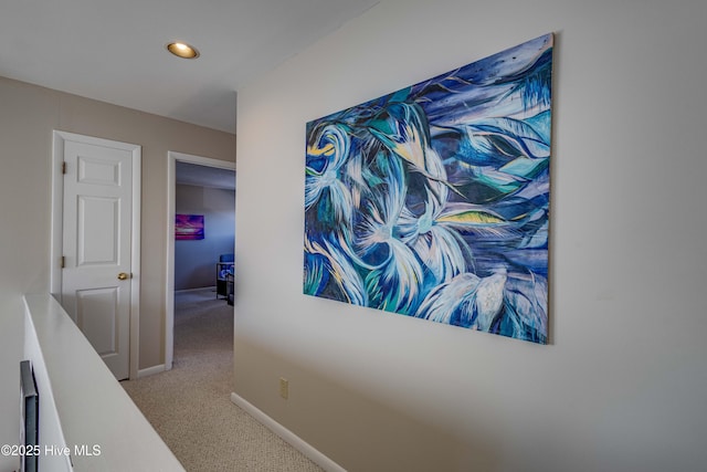 corridor featuring recessed lighting, carpet floors, and baseboards